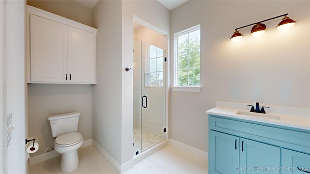 bathroom featuring vanity, toilet, and an enclosed shower