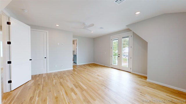 interior space with light hardwood / wood-style floors, ceiling fan, and french doors