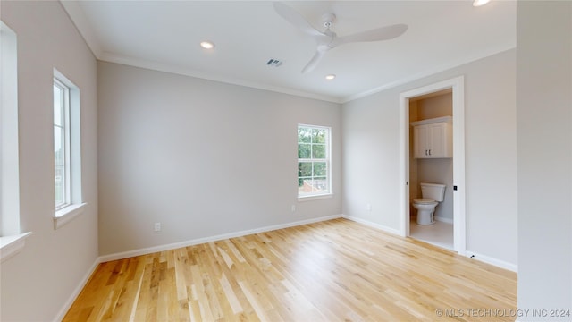 unfurnished bedroom featuring light wood-type flooring, ornamental molding, ceiling fan, and ensuite bathroom