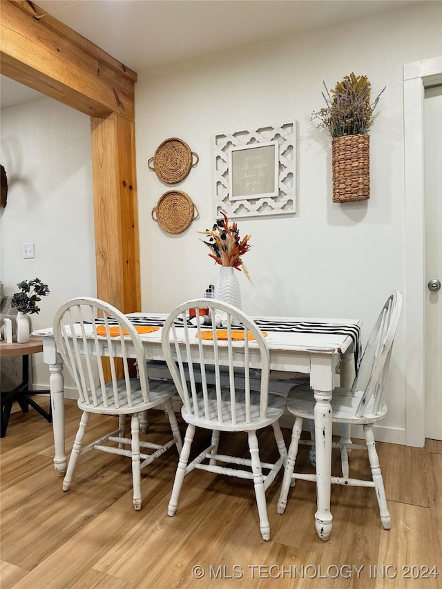 dining area with hardwood / wood-style floors