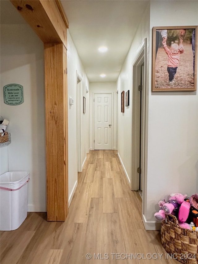 hallway featuring light hardwood / wood-style flooring