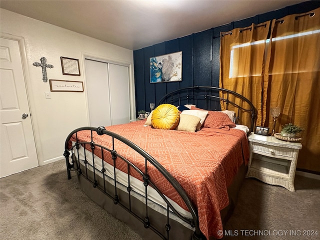 carpeted bedroom featuring a closet