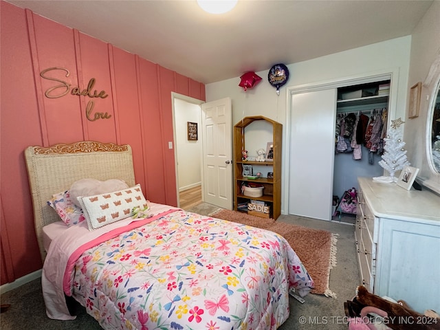 carpeted bedroom with a closet