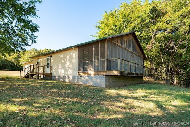 view of home's exterior with a lawn