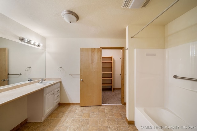 bathroom with shower / bathing tub combination and vanity