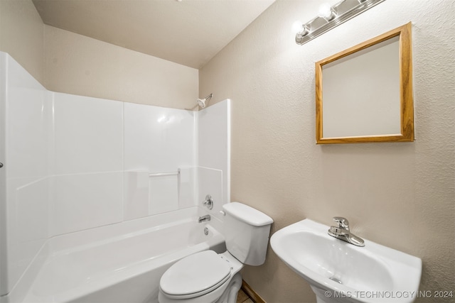 full bathroom with shower / bathing tub combination, sink, and toilet