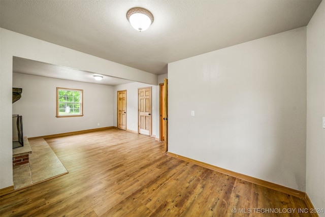 unfurnished living room with light hardwood / wood-style floors