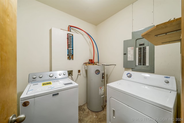 laundry area with water heater, electric panel, and washer and dryer