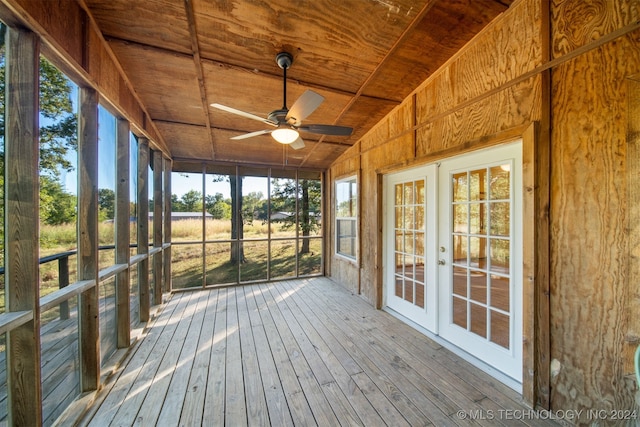 unfurnished sunroom with wooden ceiling, lofted ceiling, ceiling fan, and french doors