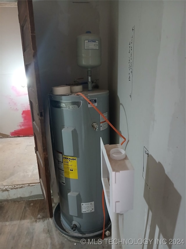 utility room with water heater