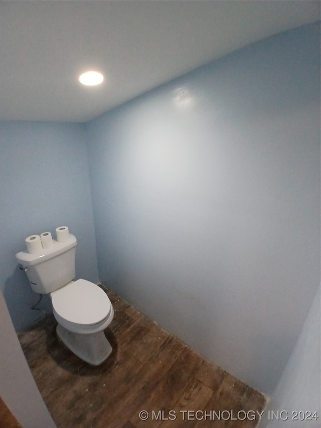 bathroom featuring toilet and hardwood / wood-style floors