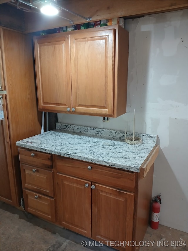 kitchen featuring light stone countertops