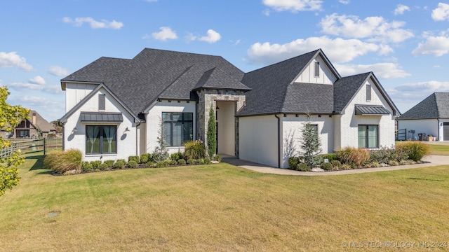 view of front of home featuring a garage and a front lawn