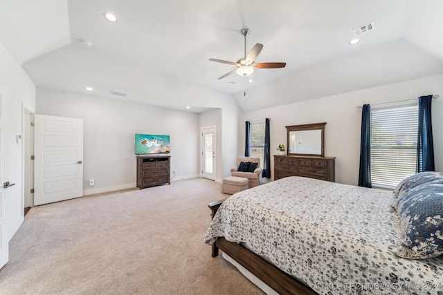 carpeted bedroom with vaulted ceiling and ceiling fan