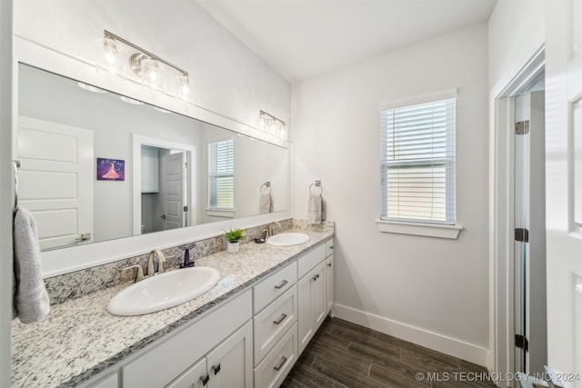 bathroom with vanity and hardwood / wood-style floors