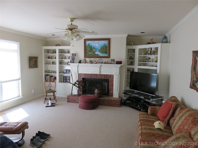 carpeted living room featuring ceiling fan, a fireplace, ornamental molding, and a healthy amount of sunlight