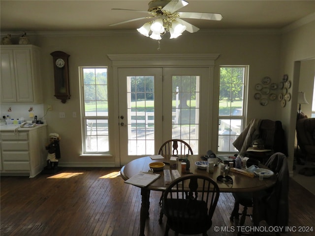 dining space with ornamental molding, ceiling fan, dark hardwood / wood-style floors, and french doors