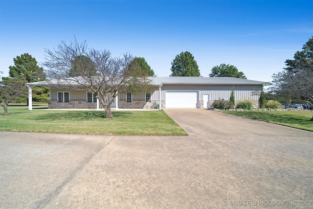 ranch-style home with a front yard and a garage