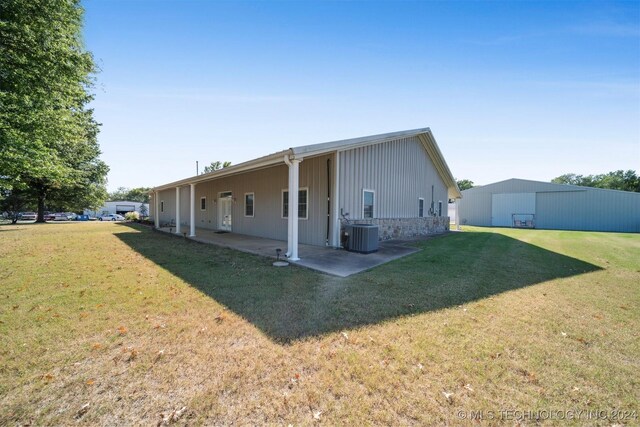 1202 SW 9th St, Wagoner, OK 74467 - exterior space featuring a yard, a patio, and central AC unit