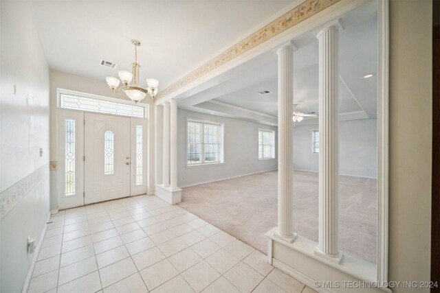 1202 SW 9th St, Wagoner, OK 74467 - entrance foyer with visible vents, baseboards, light carpet, ornate columns, and light tile patterned flooring