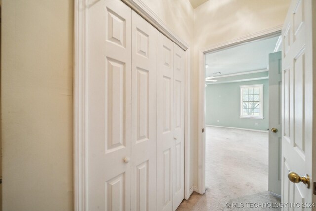 1202 SW 9th St, Wagoner, OK 74467 - corridor featuring baseboards and light colored carpet