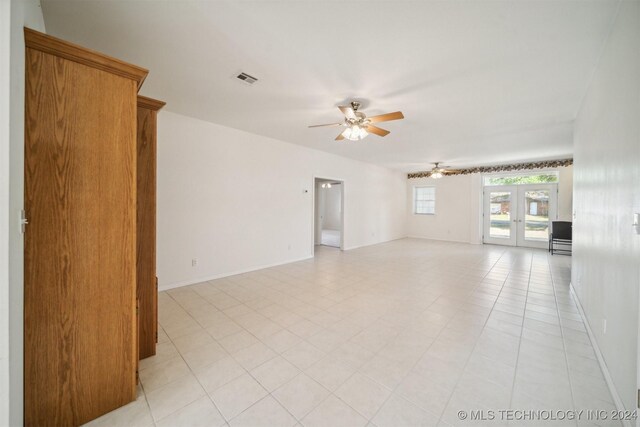 1202 SW 9th St, Wagoner, OK 74467 - spare room with visible vents, baseboards, ceiling fan, and french doors