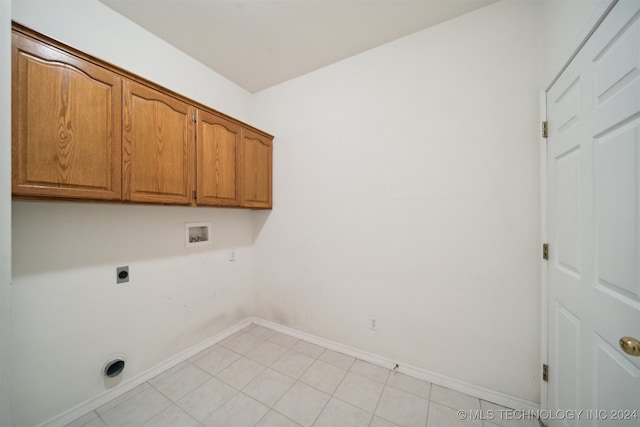 clothes washing area featuring hookup for a washing machine, cabinets, and electric dryer hookup