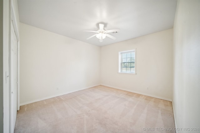 carpeted empty room with ceiling fan