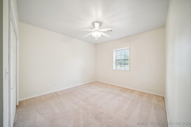 1202 SW 9th St, Wagoner, OK 74467 - unfurnished room with a ceiling fan, baseboards, and carpet