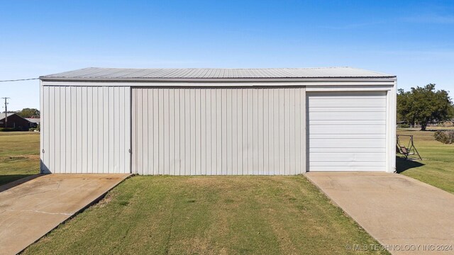 1202 SW 9th St, Wagoner, OK 74467 - view of outdoor structure featuring concrete driveway and an outbuilding