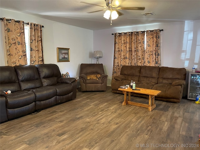 living room featuring ceiling fan, wood-type flooring, and beverage cooler