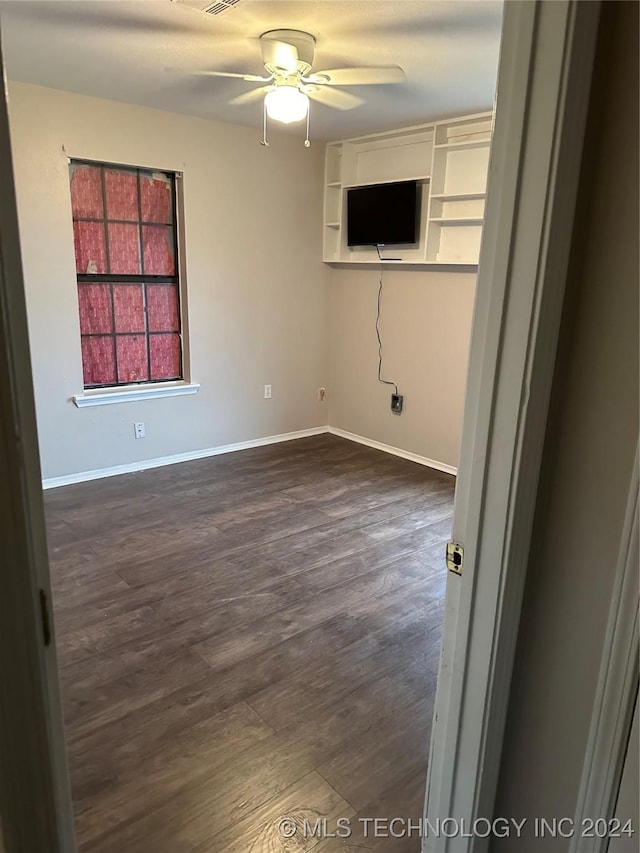 595 N 4340th Rd, Fort Towson, OK 74735 - spare room with ceiling fan, dark wood-style floors, and baseboards