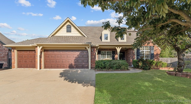 view of front of house with a garage and a front lawn