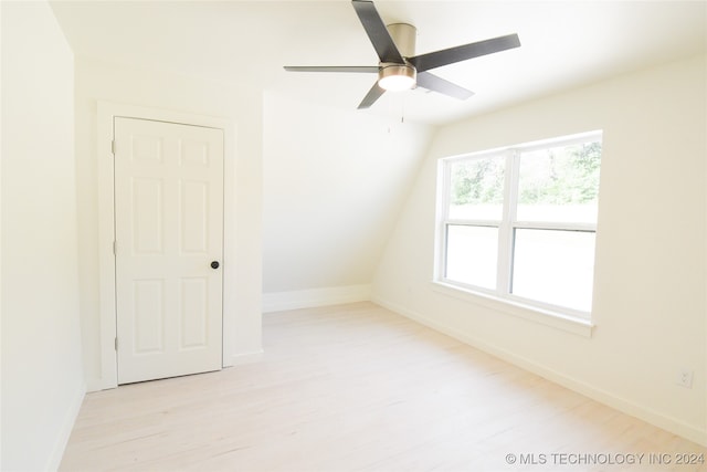 interior space featuring ceiling fan, lofted ceiling, and light hardwood / wood-style floors