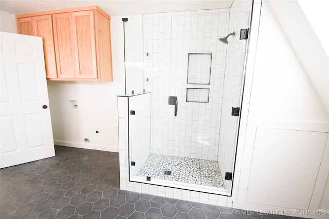 bathroom with walk in shower and tile patterned flooring