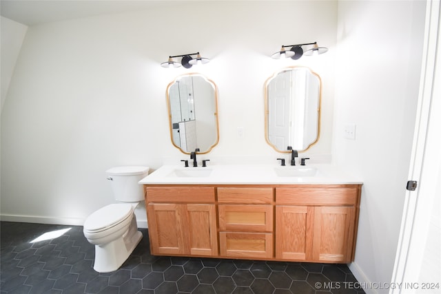 bathroom featuring vanity, toilet, and tile patterned floors