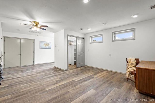 interior space with ceiling fan and light wood-type flooring