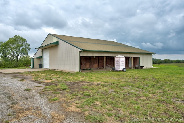 view of outdoor structure featuring a lawn