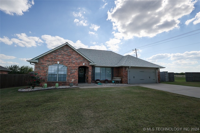 single story home featuring a front lawn and a garage