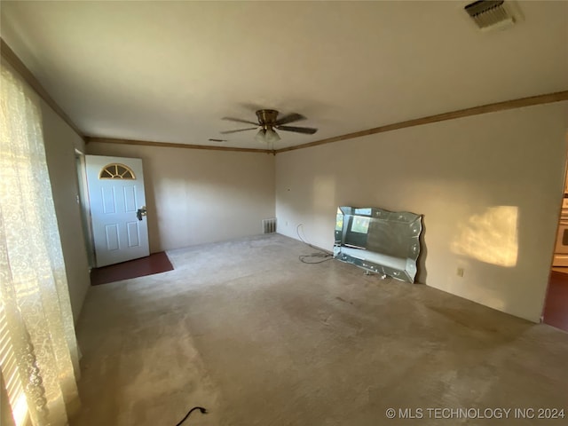 unfurnished living room with ceiling fan, carpet flooring, and ornamental molding