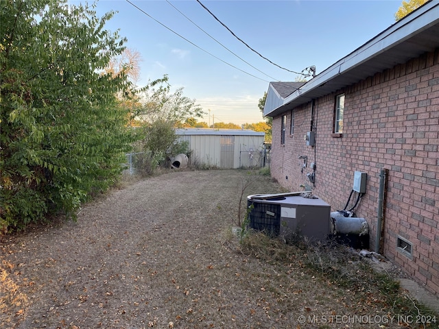 view of yard with central AC