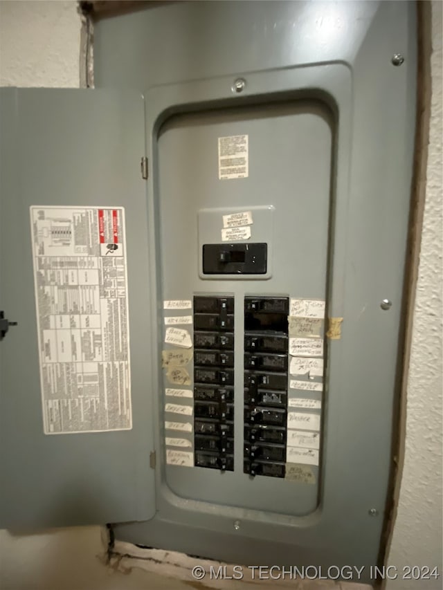 utility room featuring electric panel