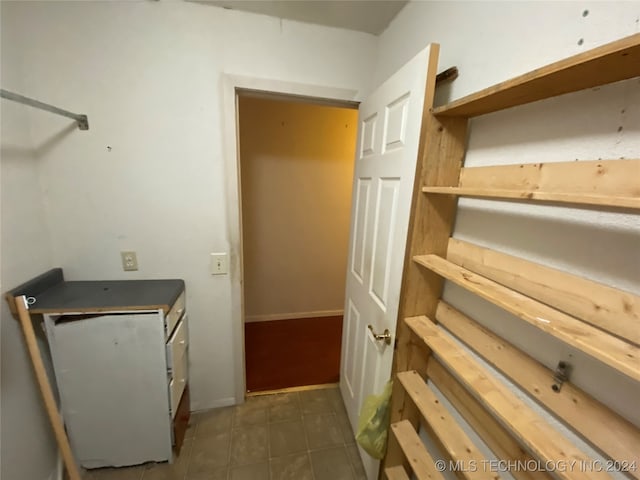 interior space featuring dark tile patterned flooring