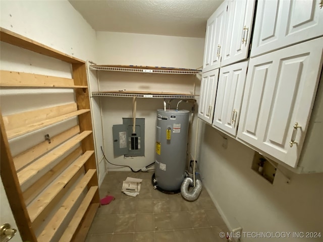 utility room featuring electric water heater and electric panel