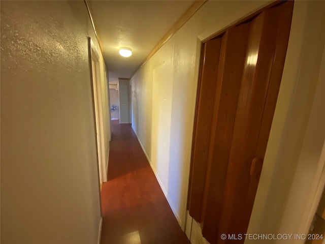 hall with dark hardwood / wood-style floors