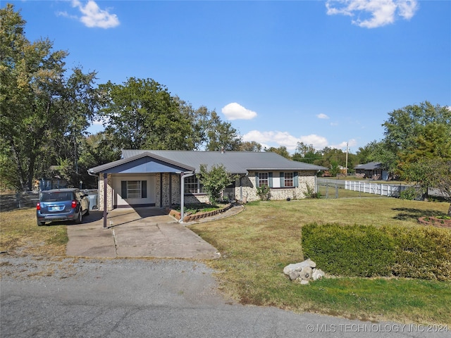 single story home with a front lawn