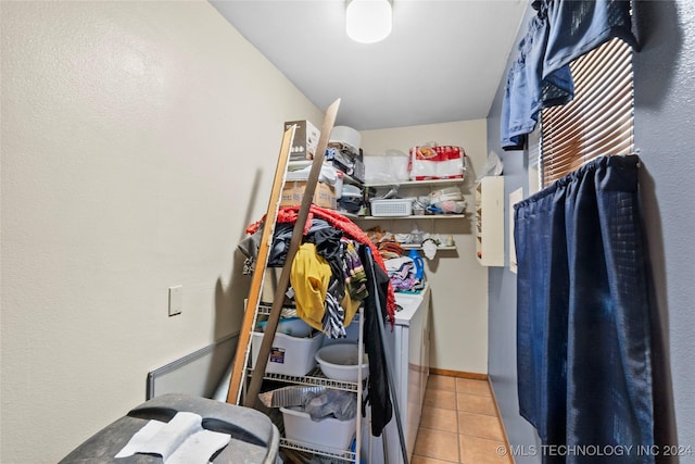 1421 S Hayes Ave, Wagoner, OK 74467 - walk in closet with washer and dryer and tile patterned floors