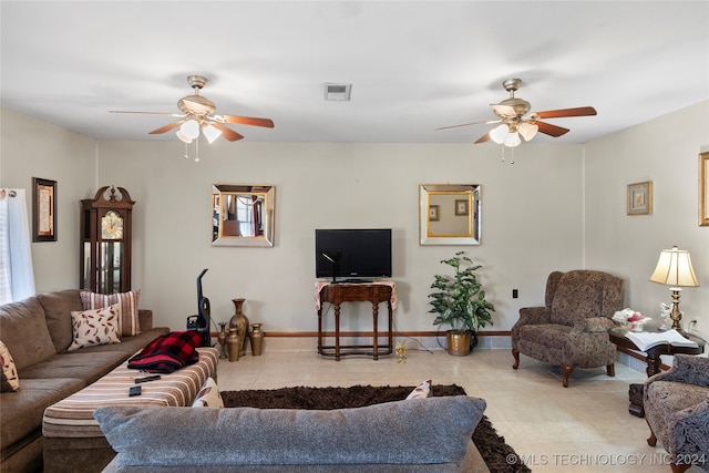 living room featuring light tile patterned flooring and ceiling fan