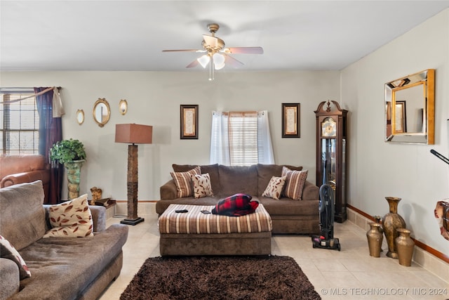 tiled living room featuring a wealth of natural light and ceiling fan