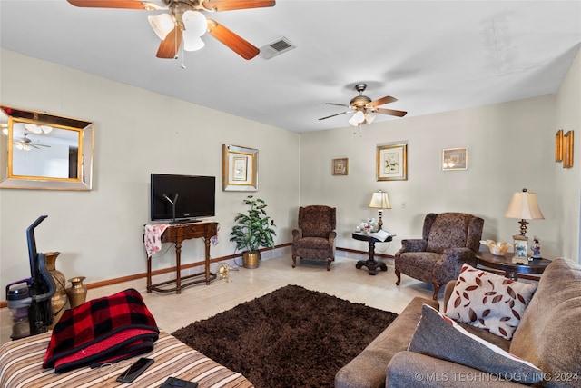 tiled living room with ceiling fan